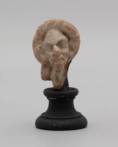 Head of a Grotesque Wearing Wreath by Ancient Greek, 2nd-1st century BCE