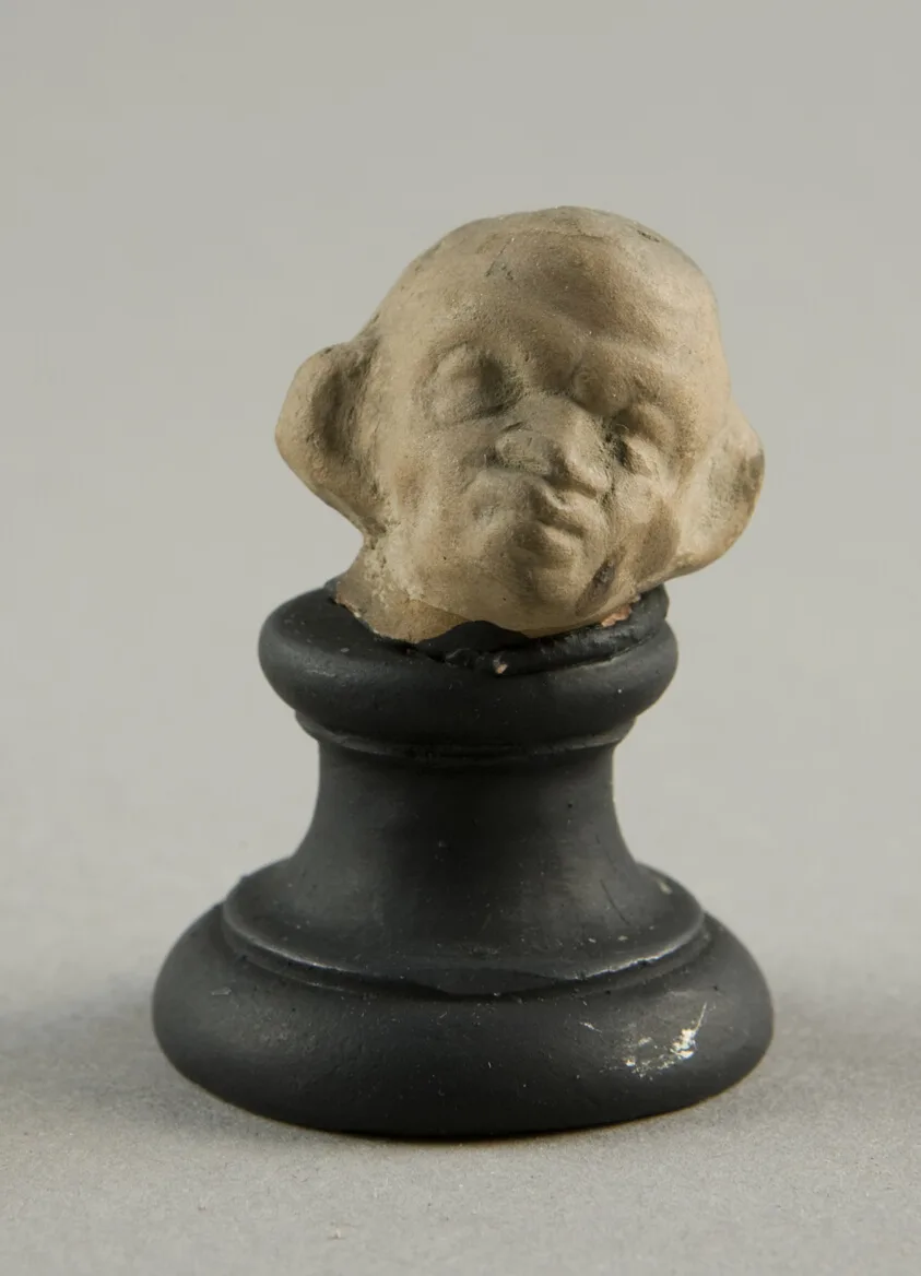 Head of a Grotesque Wearing Wreath by Ancient Greek, 2nd-1st century BCE