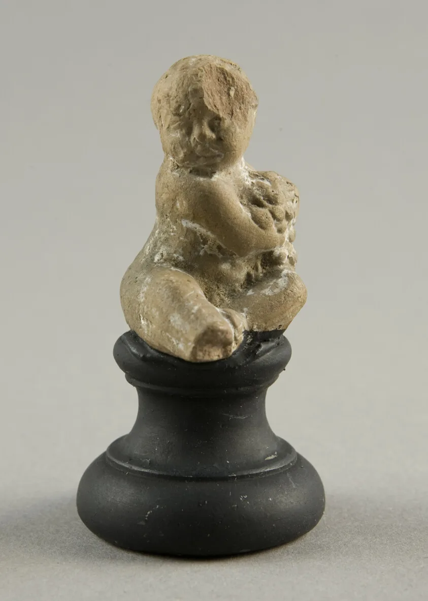 Seated Child Holding Grapes by Ancient Greek, 3rd/2nd century BCE